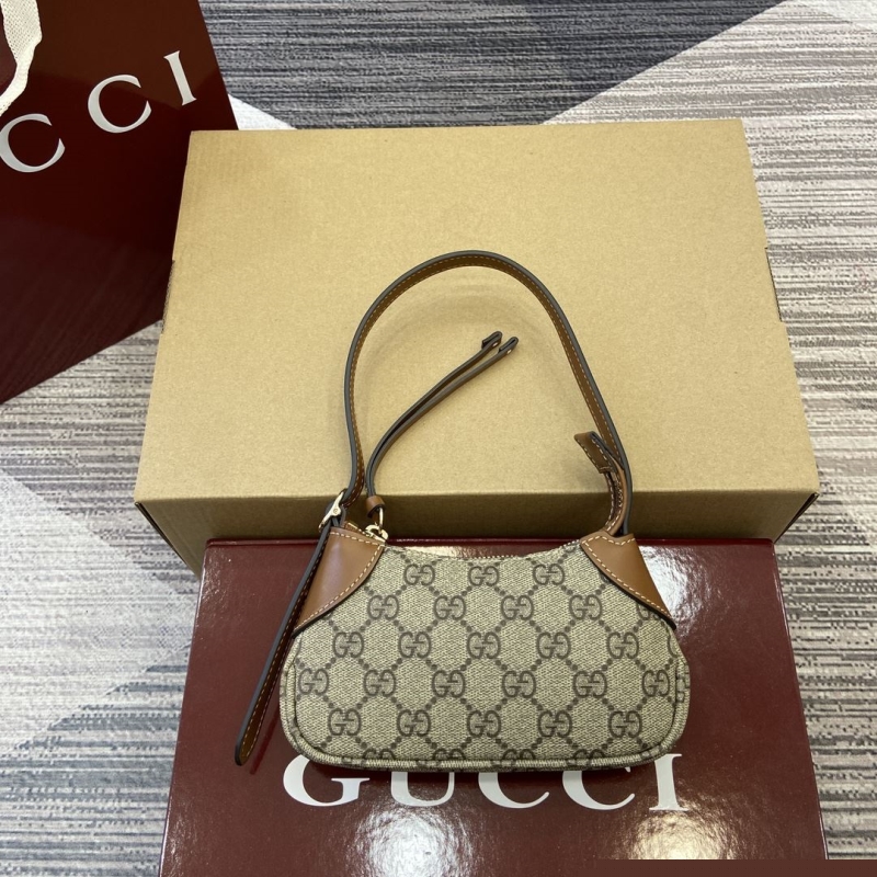 G*u*i top handle bags
